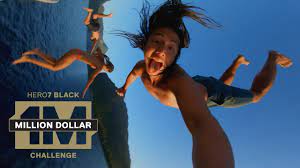 An image of two people jumping into water for a GoPro ad.