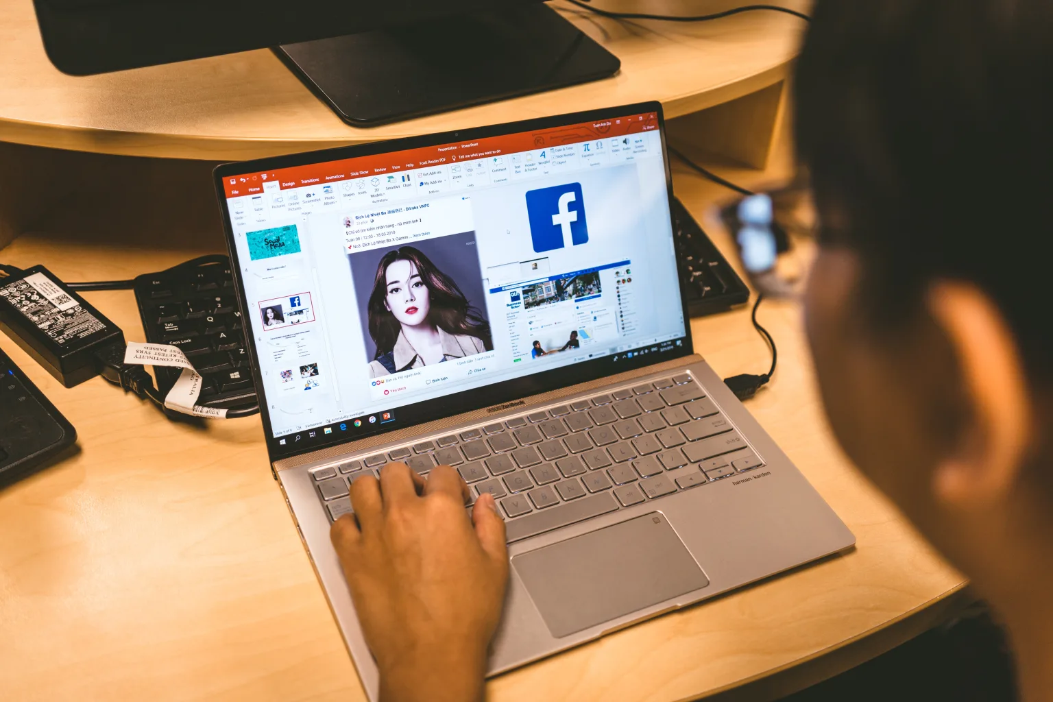 A marketer working on a Facebook ad.